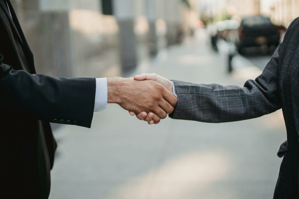 close up of business people shaking hands